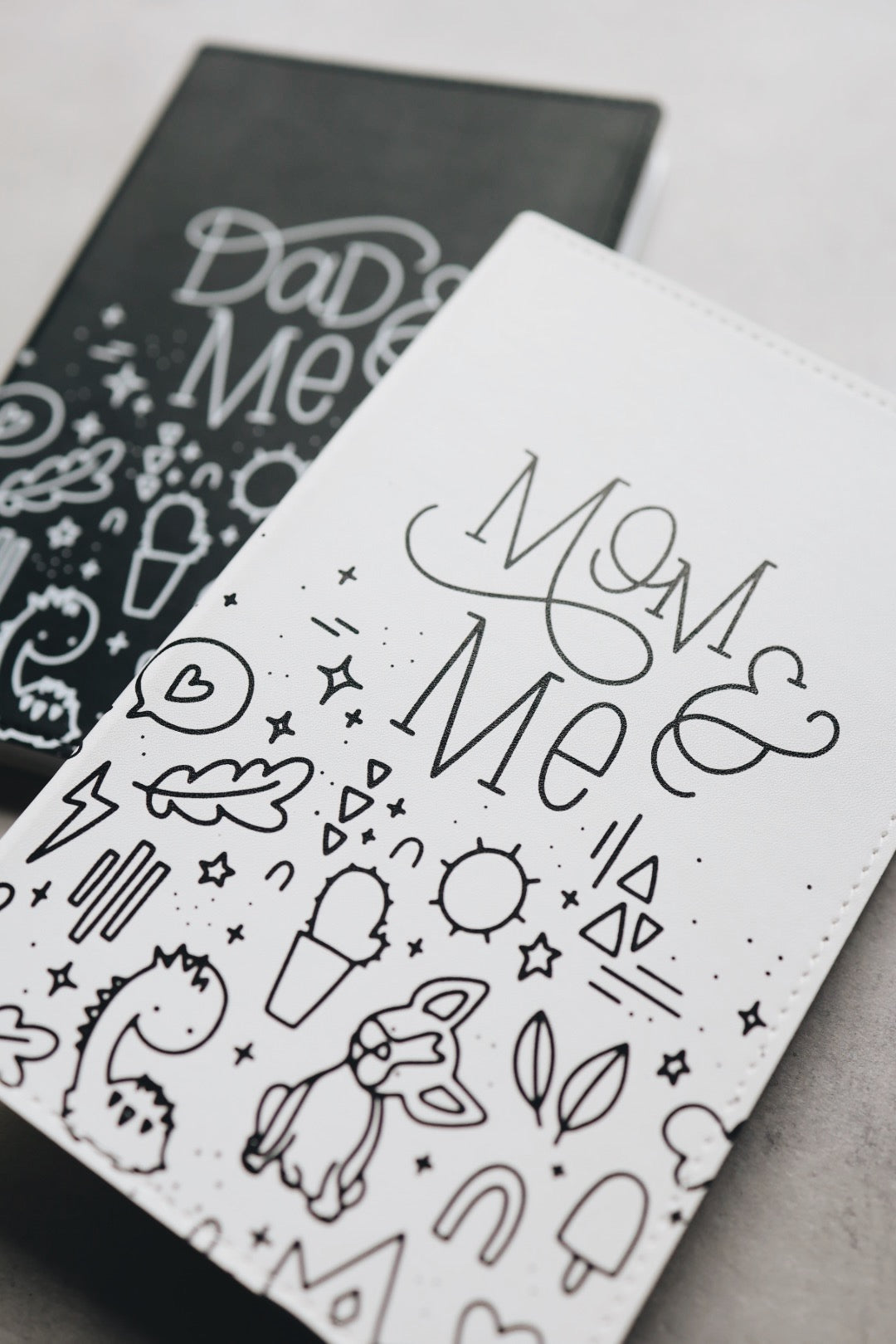 Mom & me journal mostly obscuring dad & me journal