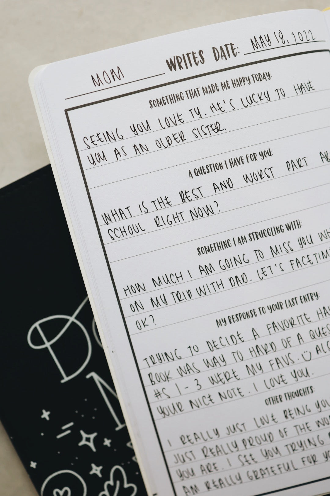 Mom & me journal opened with handwriting on page