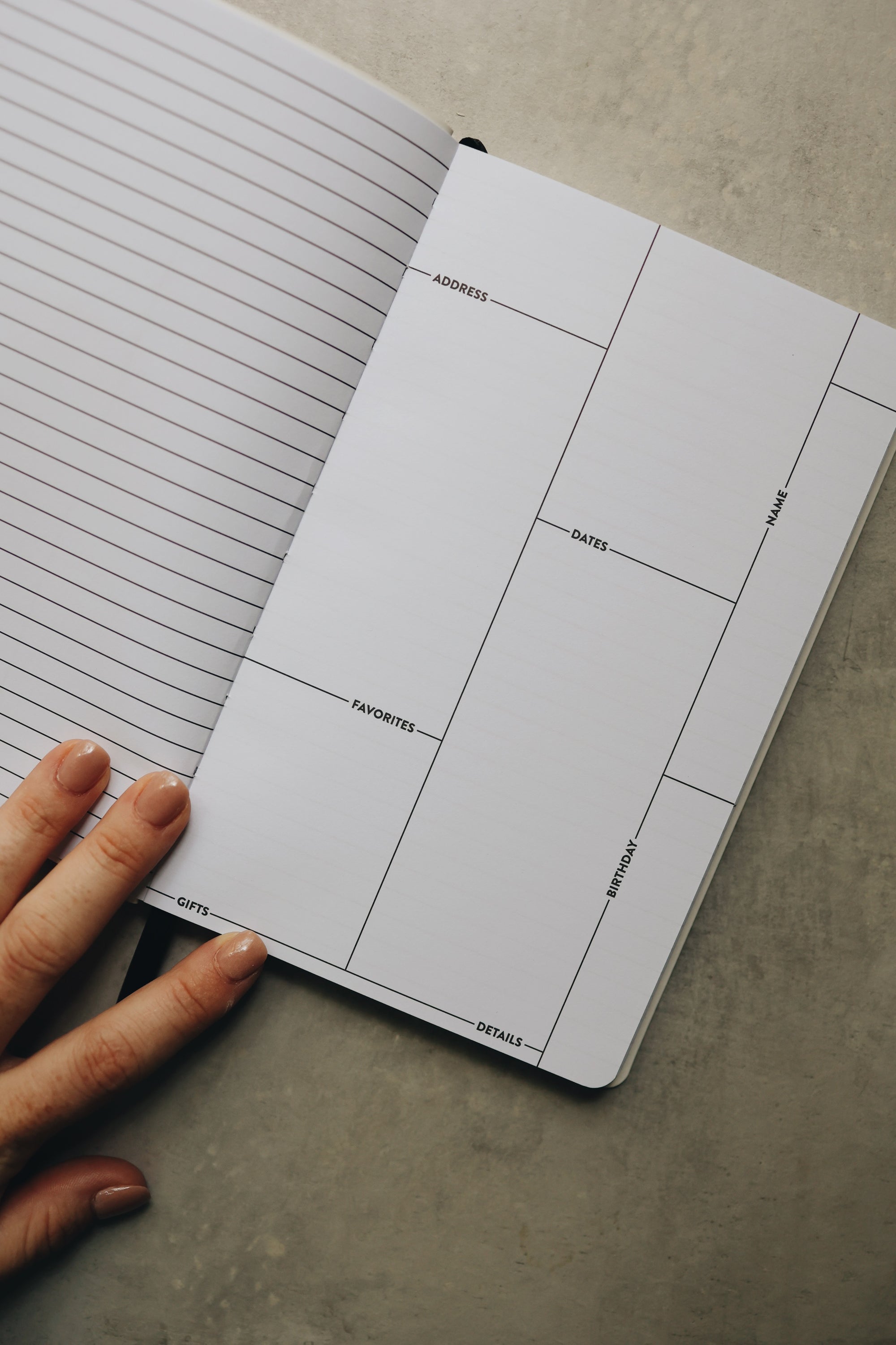 A hand holding the friendship journal open.