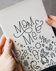 Close up of mom & me cover held by two hands