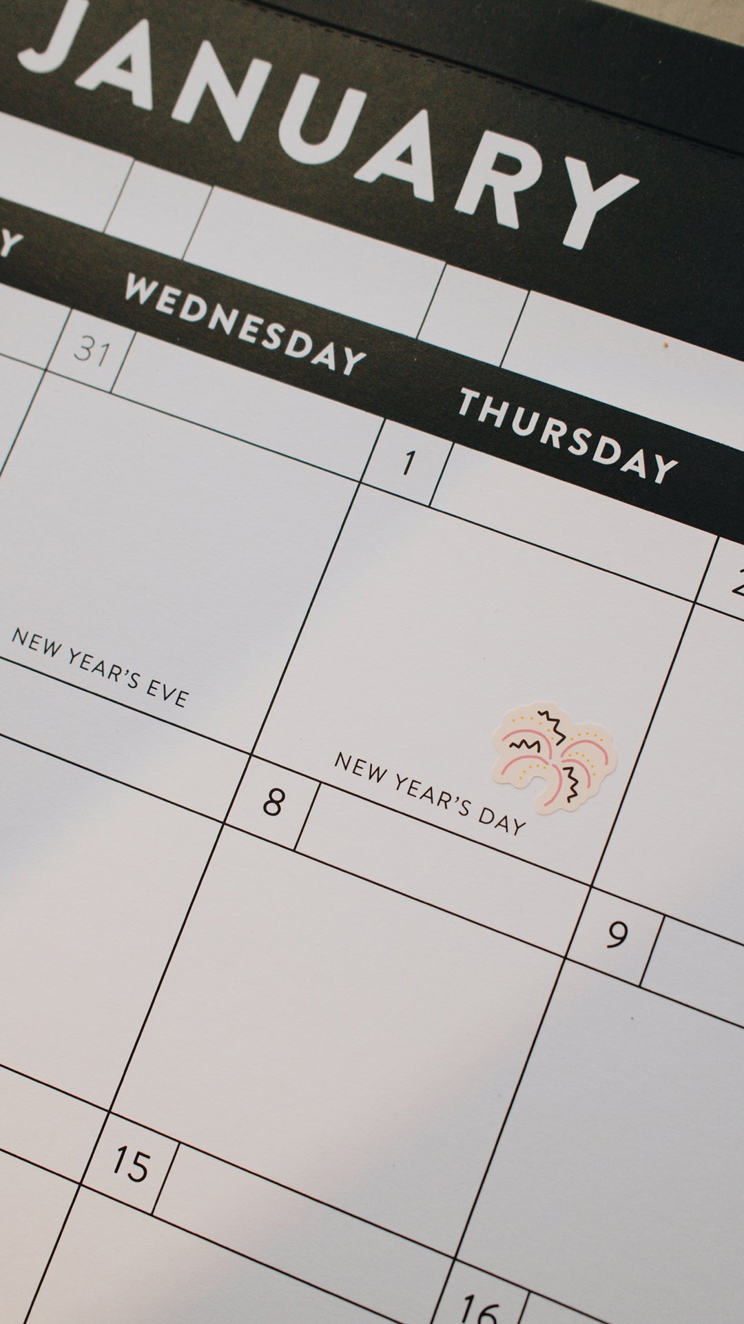 Calendar showing January with New Year's Day marked with a fireworks sticker