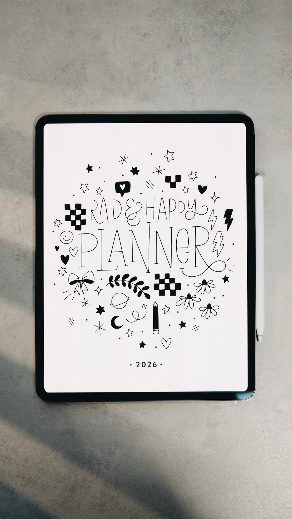 Digital planner cover with decorative text and symbols on a gray surface