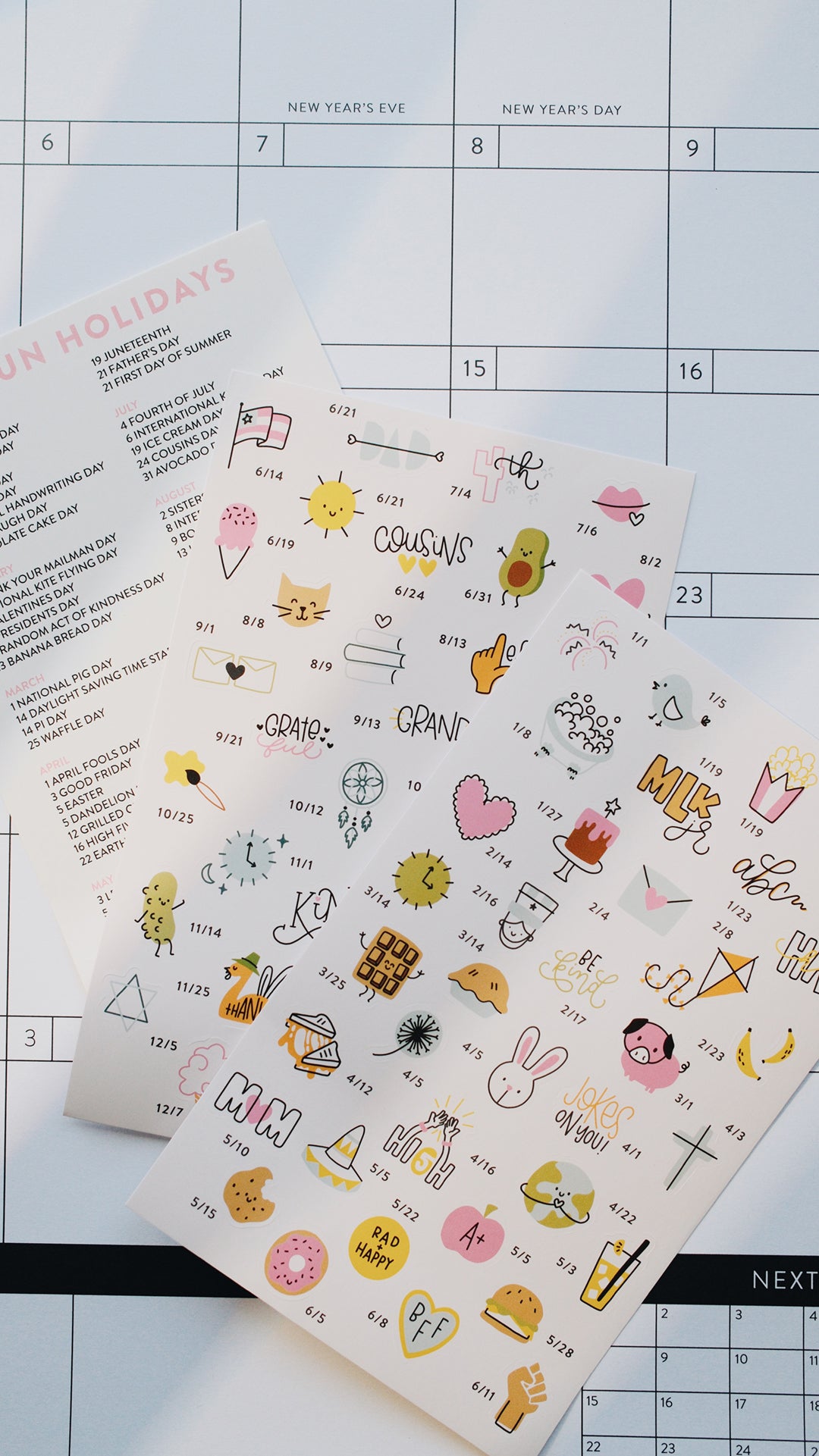 Sheet of decorative stickers with various designs on a calendar background