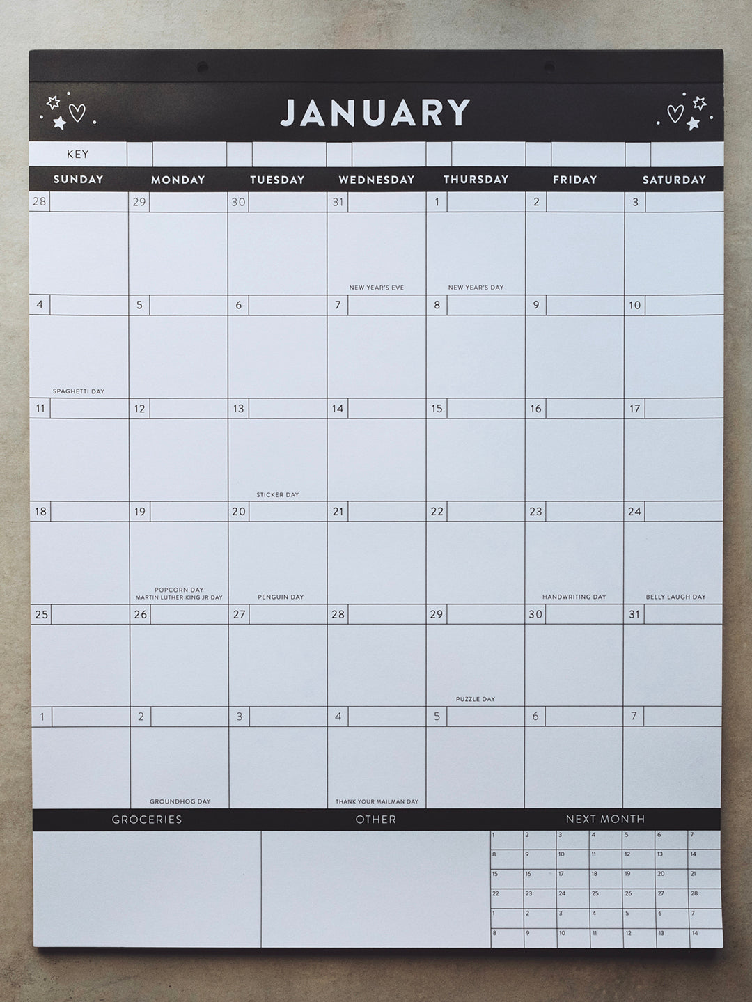 Black and white calendar on a light gray surface showing the month of January