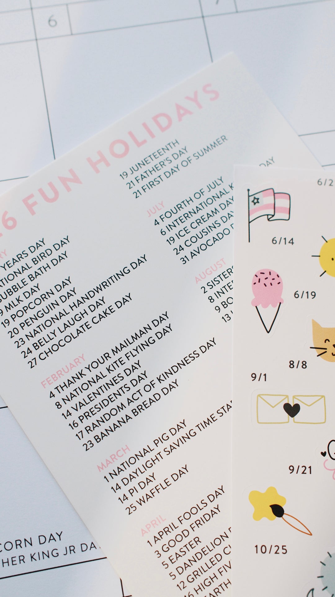 Sheet of stickers with various holidays and icons on a white surface