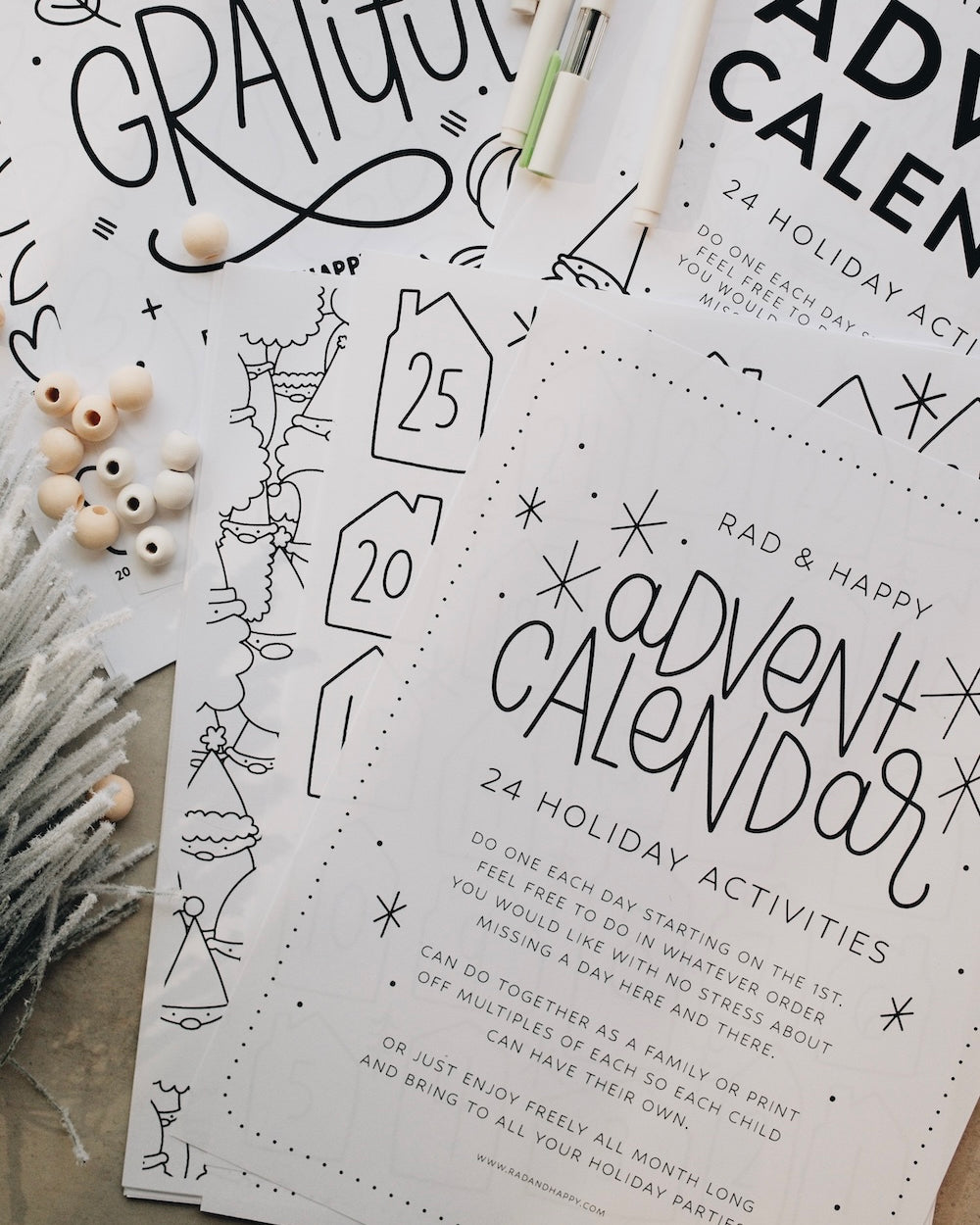Advent calendar printouts with holiday activities on a neutral background