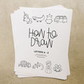 An image of the printed version of alphabet how to draw printables stacked showing the cover page which reads How to Draw